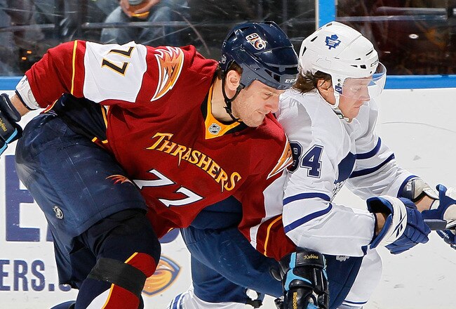 ATLANTA - MARCH 25:  Mikhail Grabovski #84 of the Toronto Maple Leafs battles for the puck against Pavel Kubina #77 of the Atlanta Thrashers at Philips Arena on March 25, 2010 in Atlanta, Georgia.  (Photo by Kevin C. Cox/Getty Images)