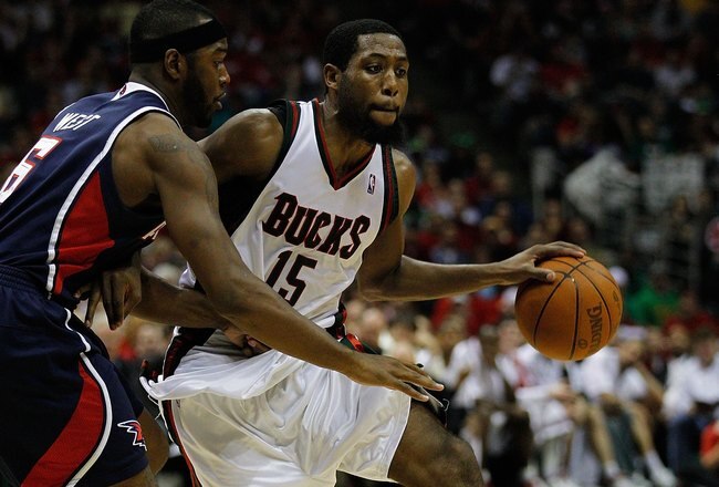 MILWAUKEE - APRIL 30: John Salmons #15 of the Milwaukee Bucks drives around Mario West #6 of the Atlanta Hawks in Game Six of the Eastern Conference Quarterfinals during the 2010 NBA Playoffs at the Bradley Center on April 30, 2010 in Milwaukee, Wisconsin. The Hawks defeated the Bucks 83-69. NOTE TO USER: User expressly acknowledges and agrees that, by downloading and/or using this Photograph, User is consenting to the terms and conditions of the Getty Images License Agreement.  (Photo by Jonathan Daniel/Getty Images)