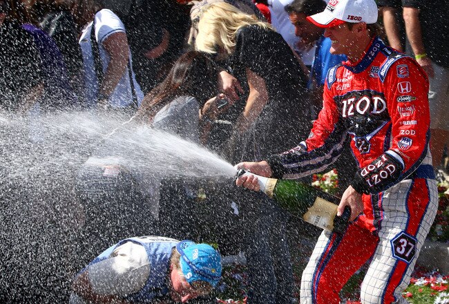 LONG BEACH - APRIL 18:  Ryan Hunter-Reay of the USA, driver of the #37 Team Izod Andretti Autosport Dallara Honda, celebrates his victory by spraying fans with champagne during the IndyCar Series Toyota Grand Prix of Long Beach on April 18, 2010 in Long Beach, California. (Photo by Donald Miralle/Getty Images)