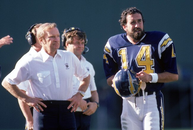 SAN DIEGO - DECEMBER 1:  Head coach Don Coryell and quarterback Dan Fouts #14 of the San Diego Chargers discuss strategy on the sidelines during a game against Buffalo Bills at Jack Murphy Stadium on December 1, 1985 in San Diego, California.  The Chargers won 40-7.  (Photo by George Rose/Getty Images)
