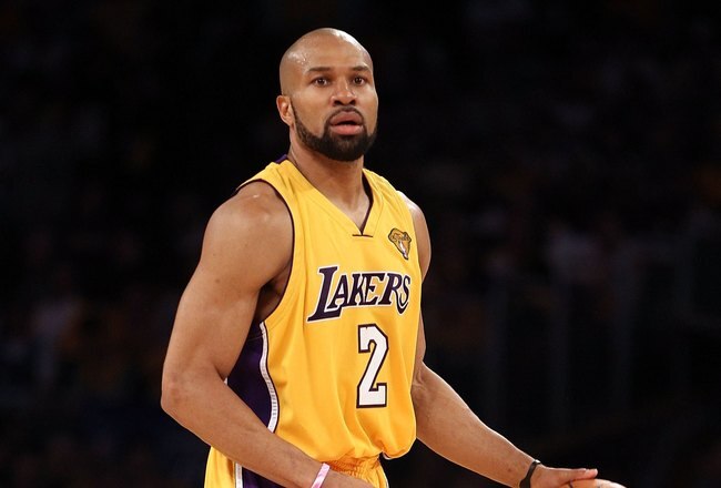 LOS ANGELES, CA - JUNE 17:  Derek Fisher #2 of the Los Angeles Lakers moves the ball in Game Seven of the 2010 NBA Finals against the Boston Celtics at Staples Center on June 17, 2010 in Los Angeles, California.  NOTE TO USER: User expressly acknowledges and agrees that, by downloading and/or using this Photograph, user is consenting to the terms and conditions of the Getty Images License Agreement.  (Photo by Christian Petersen/Getty Images)