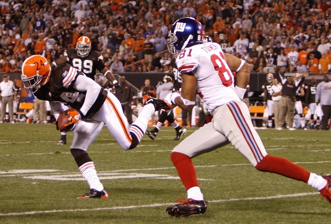 CLEVELAND - OCTOBER 13:  Eric Wright #24 of the Cleveland Browns makes a fourth quarter interception that he returned 93 yards for a touchdown against Amani Toomer #81 of the New York Giants on October 13, 2008 at Cleveland Browns Stadium in Cleveland, Ohio. Cleveland won the game 35-14. (Photo by Gregory Shamus/Getty Images)