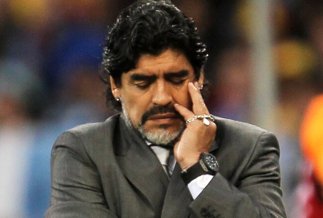 CAPE TOWN, SOUTH AFRICA - JULY 03:  Diego Maradona head coach of Argentina shows his dejection as he suffers a massive defeat in the 2010 FIFA World Cup South Africa Quarter Final match between Argentina and Germany at Green Point Stadium on July 3, 2010 in Cape Town, South Africa.  (Photo by Chris McGrath/Getty Images)