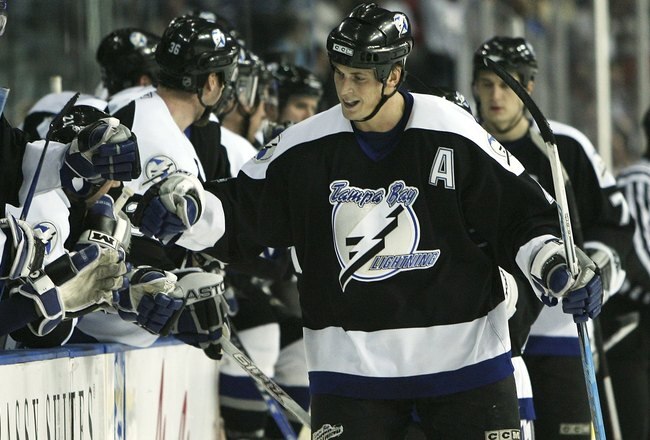 TAMPA, FL - JANUARY 16:  Vinny Lecavalier #4 of the Tampa Bay Lightning celebrates after his first period goal against the Toronto Maple Leafs at the St. Pete Times Forum on January 16, 2007 in Tampa, Florida.  (Photo by Doug Benc/Getty Images)