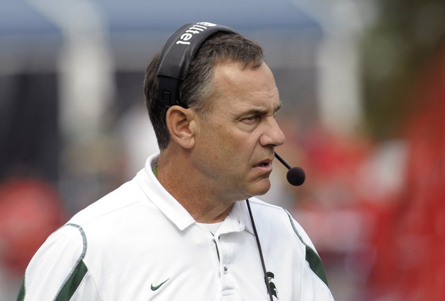 ORLANDO, FL - JANUARY 1: Coach Mark Dantonio of the Michigan State Spartans directs play against the Georgia Bulldogs at the 2009 Capital One Bowl at the Citrus Bowl on January 1, 2009 in Orlando, Florida.  (Photo by Al Messerschmidt/Getty Images)