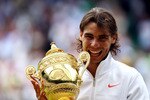 LONDON, ENGLAND - JULY 04:  Rafael Nadal of Spain holds the Championship trophy after winning the Men's Singles Final match against Tomas Berdych of Czech Republic on Day Thirteen of the Wimbledon Lawn Tennis Championships at the All England Lawn Tennis and Croquet Club on July 4, 2010 in London, England.  (Photo by Julian Finney/Getty Images)