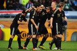 CAPE TOWN, SOUTH AFRICA - JULY 03:  The Germany team celebrate with Miroslav Klose after he scores his team's second goal during the 2010 FIFA World Cup South Africa Quarter Final match between Argentina and Germany at Green Point Stadium on July 3, 2010 in Cape Town, South Africa.  (Photo by Clive Mason/Getty Images)
