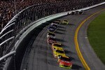 DAYTONA BEACH, FL - JULY 03:  Jeff Gordon, driver of the #24 DuPont Chevrolet, leads the field during the NASCAR Sprint Cup Series Coke Zero 400 at Daytona International Speedway on July 3, 2010 in Daytona Beach, Florida.  (Photo by Chris Graythen/Getty Images)
