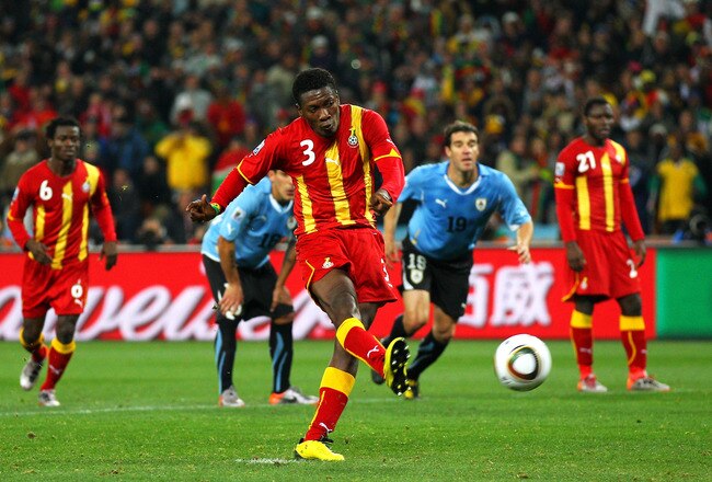JOHANNESBURG, SOUTH AFRICA - JULY 02:  Asamoah Gyan of Ghana shoots a late penalty high during the 2010 FIFA World Cup South Africa Quarter Final match between Uruguay and Ghana at the Soccer City stadium on July 2, 2010 in Johannesburg, South Africa.  (Photo by Cameron Spencer/Getty Images)