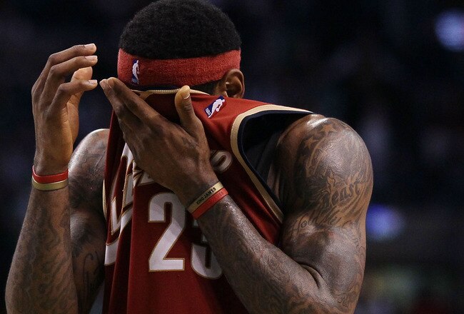 BOSTON - MAY 13:  LeBron James #23 of the Cleveland Cavaliers wipes the sweat from his face in the fourth quarter against the Boston Celtics during Game Six of the Eastern Conference Semifinals of the 2010 NBA playoffs at TD Garden on May 13, 2010 in Boston, Massachusetts. The Celtics defeated the Cavaliers 94-85.  NOTE TO USER: User Expressly Acknowledges and agrees that, by downloading and or using this photograph, User is consenting to the terms and conditions of the Getty Images License Agreement.  (Photo by Elsa/Getty Images)