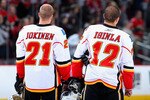 GLENDALE, AZ - DECEMBER 03:  Olli Jokinen#21 and Jarome Iginla #12 of the Calgary Flames stand for the National Anthem before the NHL game against the Phoenix Coyotes at Jobing.com Arena on December 3, 2009 in Glendale, Arizona.  The Coyotes defeated the Flames 2-1.  (Photo by Christian Petersen/Getty Images)