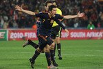 JOHANNESBURG, SOUTH AFRICA - JULY 03:  David Villa of Spain celebrates after he scores his side's first goal with team mate Francesc Fabregas during the 2010 FIFA World Cup South Africa Quarter Final match between Paraguay and Spain at Ellis Park Stadium on July 3, 2010 in Johannesburg, South Africa.  (Photo by Jasper Juinen/Getty Images)