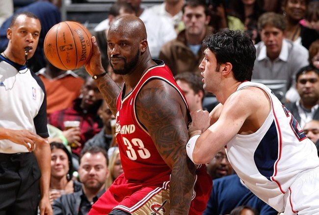 ATLANTA - DECEMBER 29:  Shaquille O'Neal #33 of the Cleveland Cavaliers against Zaza Pachulia #27 of the Atlanta Hawks at Philips Arena on December 29, 2009 in Atlanta, Georgia.  NOTE TO USER: User expressly acknowledges and agrees that, by downloading and/or using this Photograph, User is consenting to the terms and conditions of the Getty Images License Agreement.  (Photo by Kevin C. Cox/Getty Images)