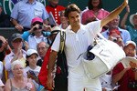 LONDON, ENGLAND - JUNE 30:  Roger Federer of Switzerland waves as he exits after losing his Quarter Final match against Tomas Berdych of Czech Republic on Day Nine of the Wimbledon Lawn Tennis Championships at the All England Lawn Tennis and Croquet Club on June 30, 2010 in London, England.  (Photo by Julian Finney/Getty Images)