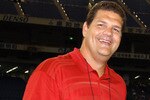 ESPN television crew on the sidelines before the 2005 American Bowl in the Toyko Dome, August 6, in Japan.  Mike Golic (left), Mike Tirico and Chris Mortensen (right).  (Photo by Al Messerschmidt/Getty Images)