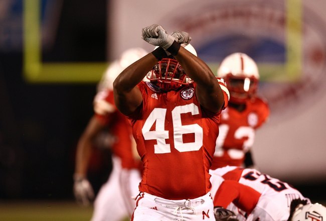 SAN DIEGO - DECEMBER 30:  Eric Martin #46 of the University of Nebraska Cornhuskers celebrates after a defensive play during the Pacific Life Holiday Bowl against University of Arizona Wildcats on December 30, 2009 at Qualcomm Stadium in San Diego, California. The Cornhuskers defeated the Wildcats 33-0. (Photo By Donald Miralle/Getty Images)