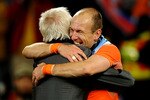 CAPE TOWN, SOUTH AFRICA - JULY 06:  Bert van Marwijk head coach of the Netherlands celebrates with Arjen Robben during the 2010 FIFA World Cup South Africa Semi Final match between Uruguay and the Netherlands at Green Point Stadium on July 6, 2010 in Cape Town, South Africa.  (Photo by Laurence Griffiths/Getty Images)