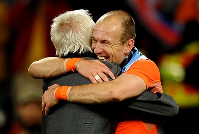 CAPE TOWN, SOUTH AFRICA - JULY 06:  Bert van Marwijk head coach of the Netherlands celebrates with Arjen Robben during the 2010 FIFA World Cup South Africa Semi Final match between Uruguay and the Netherlands at Green Point Stadium on July 6, 2010 in Cape Town, South Africa.  (Photo by Laurence Griffiths/Getty Images)