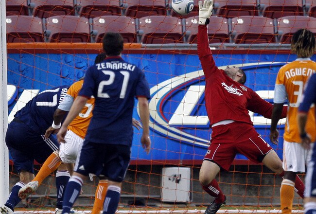 HOUSTON - JULY 06:  Goalkeeper Tally Hall #1 of the Houston Dynamo is beaten for a score on a header by Justin Braun #17 of Chivas USA in the first half at Robertson Stadium on July 6, 2010 in Houston, Texas.  (Photo by Bob Levey/Getty Images)