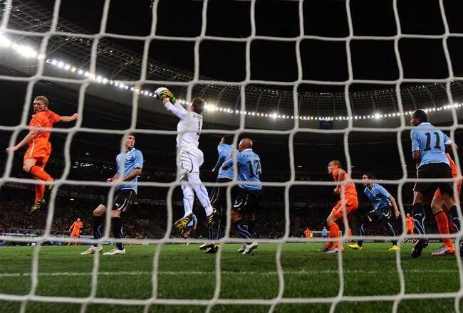 CAPE TOWN, SOUTH AFRICA - JULY 06:  Fernando Muslera of Uruguay catches the ball during the 2010 FIFA World Cup South Africa Semi Final match between Uruguay and the Netherlands at Green Point Stadium on July 6, 2010 in Cape Town, South Africa.  (Photo by Laurence Griffiths/Getty Images)