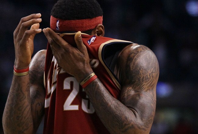 BOSTON - MAY 13:  LeBron James #23 of the Cleveland Cavaliers wipes the sweat from his face in the fourth quarter against the Boston Celtics during Game Six of the Eastern Conference Semifinals of the 2010 NBA playoffs at TD Garden on May 13, 2010 in Boston, Massachusetts. The Celtics defeated the Cavaliers 94-85.  NOTE TO USER: User Expressly Acknowledges and agrees that, by downloading and or using this photograph, User is consenting to the terms and conditions of the Getty Images License Agreement.  (Photo by Elsa/Getty Images)