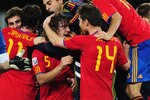 DURBAN, SOUTH AFRICA - JULY 07:  Carles Puyol of Spain (L) celebrates with team mate Xabi Alonso after victory and progress to the final during the 2010 FIFA World Cup South Africa Semi Final match between Germany and Spain at Durban Stadium on July 7, 2010 in Durban, South Africa.  (Photo by Clive Mason/Getty Images)