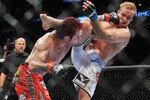 PORTLAND, OR - AUGUST 29:  UFC fighter Chris Leben (L) battles UFC fighter Jake Rosholt (R) during their Middleweight bout at UFC 102:  Couture vs. Nogueira at the Rose Garden Arena on August 29, 2009 in Portland, Oregon.  (Photo by Jon Kopaloff/Getty Images)