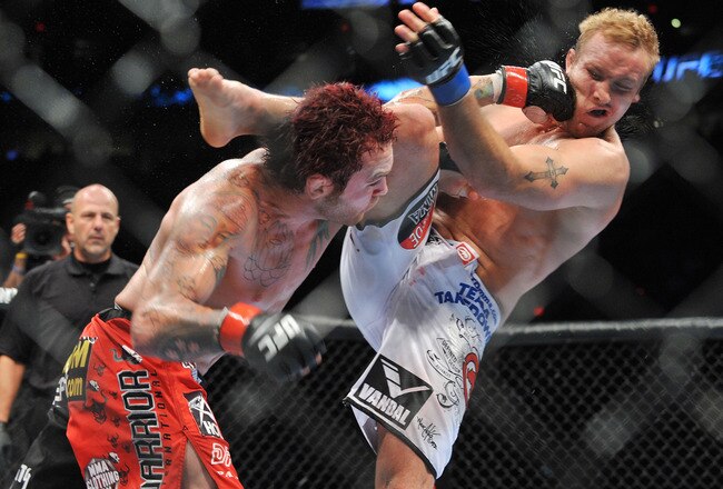 PORTLAND, OR - AUGUST 29:  UFC fighter Chris Leben (L) battles UFC fighter Jake Rosholt (R) during their Middleweight bout at UFC 102:  Couture vs. Nogueira at the Rose Garden Arena on August 29, 2009 in Portland, Oregon.  (Photo by Jon Kopaloff/Getty Images)