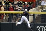 PHOENIX - JULY 03:  Outfielder Justin Upton #10 of the Arizona Diamondbacks attempts a leaping catch on the home run hit by Andre Ethier (not pictured) of the Los Angeles Dodgers during the fourth inning of the Major League Baseball game at Chase Field on July 3, 2010 in Phoenix, Arizona.  (Photo by Christian Petersen/Getty Images)