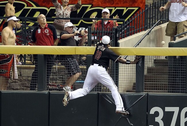 PHOENIX - JULY 03:  Outfielder Justin Upton #10 of the Arizona Diamondbacks attempts a leaping catch on the home run hit by Andre Ethier (not pictured) of the Los Angeles Dodgers during the fourth inning of the Major League Baseball game at Chase Field on July 3, 2010 in Phoenix, Arizona.  (Photo by Christian Petersen/Getty Images)