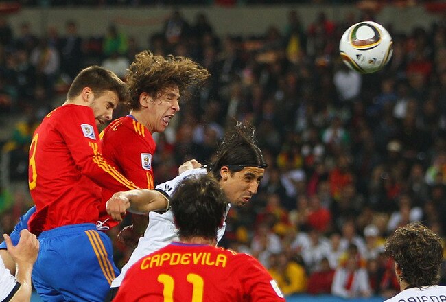 DURBAN, SOUTH AFRICA - JULY 07:  Carles Puyol of Spain scores the opening goal during the 2010 FIFA World Cup South Africa Semi Final match between Germany and Spain at Durban Stadium on July 7, 2010 in Durban, South Africa.  (Photo by Michael Steele/Getty Images)