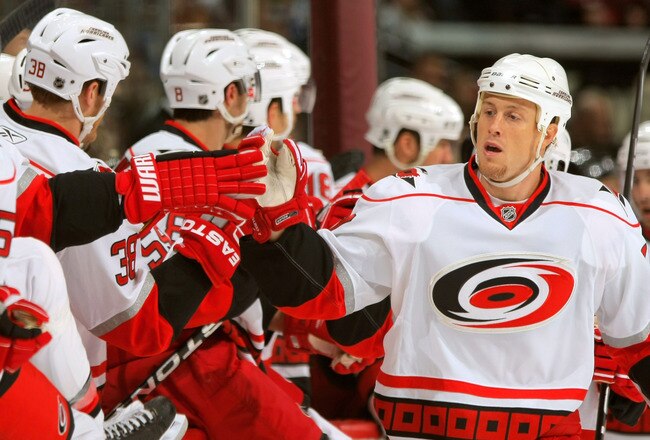 DENVER - OCTOBER 23:  Joe Corvo #77 of the Carolina Hurricanes celebrates his first period goal against the Colorado Avalanche with his teammates during NHL action on action on October 23, 2009 at the Pepsi Center in Denver, Colorado.  (Photo by Doug Pensinger/Getty Images)