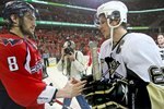 WASHINGTON - MAY 13:  Alex Ovechkin #8 of the Washington Capitals and Sidney Crosby #87 of the Pittsburgh Penguins shake hands after Pittsburgh's 6-2 victory in Game Seven of the Eastern Conference Semifinal  Round of the 2009 Stanley Cup Playoffs at Verizon Center on May 13, 2009 in Washington, DC.  (Photo by Bruce Bennett/Getty Images)
