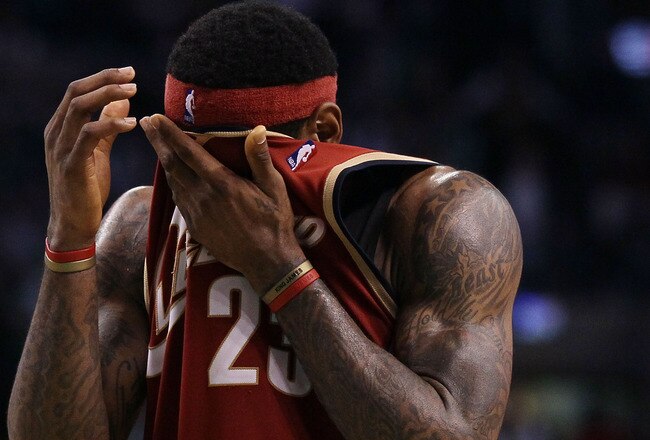 BOSTON - MAY 13:  LeBron James #23 of the Cleveland Cavaliers wipes the sweat from his face in the fourth quarter against the Boston Celtics during Game Six of the Eastern Conference Semifinals of the 2010 NBA playoffs at TD Garden on May 13, 2010 in Boston, Massachusetts. The Celtics defeated the Cavaliers 94-85.  NOTE TO USER: User Expressly Acknowledges and agrees that, by downloading and or using this photograph, User is consenting to the terms and conditions of the Getty Images License Agreement.  (Photo by Elsa/Getty Images)