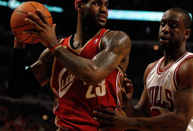CHICAGO - APRIL 25: LeBron James #23 of the Cleveland Cavaliers looks to pass around Ronald Murray #6 of the Chicago Bulls in Game Four of the Eastern Conference Quarterfinals during the 2010 NBA Playoffs at the United Center on April 25, 2010 in Chicago, Illinois. The Cavaliers defeated the Bulls 121-98. NOTE TO USER: User expressly acknowledges and agrees that, by downloading and/or using this Photograph, User is consenting to the terms and conditions of the Getty Images License Agreement.  (Photo by Jonathan Daniel/Getty Images)