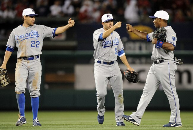 ANAHEIM, CA - JULY 02:  Jose Guillen #6, David DeJesus #9 and Scott Podsednik #22 of the Kansas City Royals celebrate a 2-1 victory over the Los Angeles Angels during the 10th inning at Angel Stadium on July 2, 2010 in Anaheim, California.  (Photo by Harry How/Getty Images)