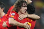 DURBAN, SOUTH AFRICA - JULY 07:  Carles Puyol of Spain celebrates scoring the opening goal with team mate Xavi Hernandez during the 2010 FIFA World Cup South Africa Semi Final match between Germany and Spain at Durban Stadium on July 7, 2010 in Durban, South Africa.  (Photo by Joern Pollex/Getty Images)