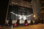 CLEVELAND - JULY 8:  Police stand guard near a larger than life photograph of LeBron James after the announcement that James will play next season for the Miami Heat July 8, 2010 in Cleveland, Ohio. The two-time Most Valuable Player made the choice to play for Miami next season. (Photo by J.D. Pooley/Getty Images)