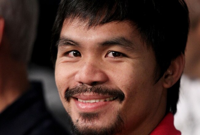 NEW YORK - JUNE 05:  Professional boxer Manny Pacquiao watches the bout between Yuri Foreman and Miguel Cotto of Puerto Rico in the WBA world super welterweight title fight on June 5, 2010 at Yankee Stadium in the Bronx borough of New York City. Cotto wins by TKO in the ninth round. (Photo by Al Bello/Getty Images)