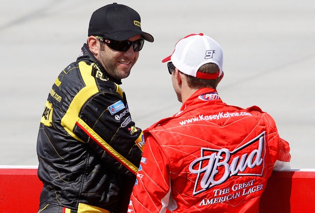 DOVER, DE - MAY 14:  Elliott Sadler (L), driver of the #19 Stanley Ford, talks with Kasey Kahne, driver of the #9 Budweiser Ford, during qualifying for the NASCAR Sprint Cup Series Autism Speaks 400 at Dover International Speedway on May 14, 2010 in Dover, Delaware.  (Photo by Todd Warshaw/Getty Images)