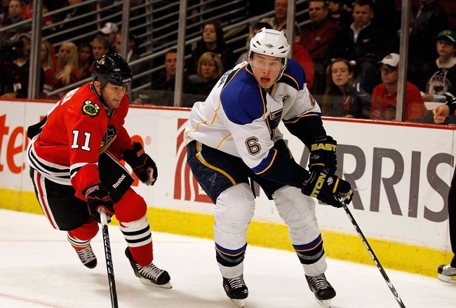 CHICAGO - APRIL 07: Erik Johnson #6 of the St. Louis Blues controls down the puck under pressure from John Madden #11 of the Chicago Blackhawks at the United Center on April 7, 2010 in Chicago, Illinois. The Blackhawks defeated the Blues 6-5. (Photo by Jonathan Daniel/Getty Images)