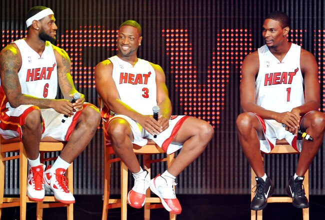 MIAMI - JULY 09:   LeBron James #6, Dwyane Wade #3 and Chris Bosh #1 of the Miami Heat speak after being introduced to fans during a welcome party at American Airlines Arena on July 9, 2010 in Miami, Florida.  (Photo by Doug Benc/Getty Images)