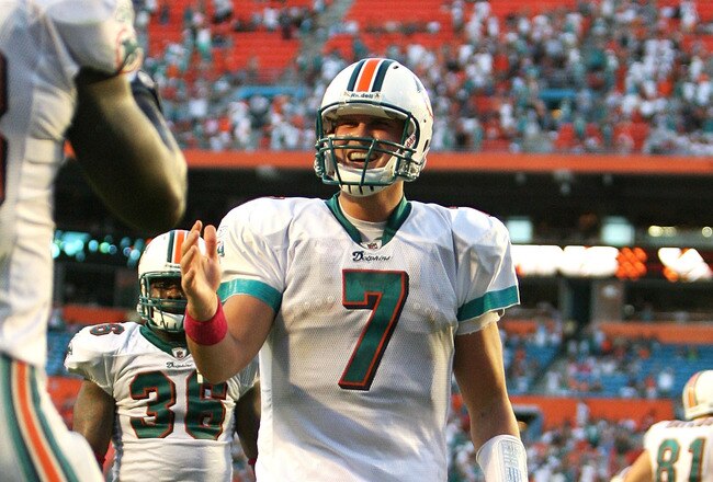 MIAMI - OCTOBER 04:  Quarterback Chad Henne #7 of the Miami Dolphins runs to celebrate with running back Ronnie Brown #23 after Brown's touchdown run in the fourth quarter against the Buffalo Bills at Land Shark Stadium on October 4, 2009 in Miami, Florida. The Dolphins defeated the Bills 38-10.  (Photo by Doug Benc/Getty Images)