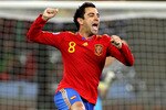 CAPE TOWN, SOUTH AFRICA - JUNE 29:  Xavi Hernandez, captain of Spain, celebrates victory following the 2010 FIFA World Cup South Africa Round of Sixteen match between Spain and Portugal at Green Point Stadium on June 29, 2010 in Cape Town, South Africa.  (Photo by Doug Pensinger/Getty Images)
