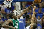 ORLANDO, FL - MAY 16:  Kendrick Perkins #43 of the Boston Celtics blocks a shot attempt by Jameer Nelson #14 of the Orlando Magic in Game One of the Eastern Conference Finals during the 2010 NBA Playoffs at Amway Arena on May 16, 2010 in Orlando, Florida.  NOTE TO USER: User expressly acknowledges and agrees that, by downloading and/or using this Photograph, user is consenting to the terms and conditions of the Getty Images License Agreement.  (Photo by Kevin C. Cox/Getty Images)