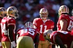 SAN FRANCISCO - NOVEMBER 29:  Alex Smith #11 of the San Francisco 49ers talks to his team in the huddle during their game against the Jacksonville Jaguars at Candlestick Park on November 29, 2009 in San Francisco, California.  (Photo by Ezra Shaw/Getty Images)