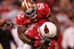 SAN FRANCISCO - DECEMBER 14:  Quarterback Kurt Warner #13 of the Arizona Cardinals is sacked by linebacker Patrick Willis #52 of the San Francisco 49ers at Candlestick Park on December 14, 2009 in San Francisco, California. (Photo by Ezra Shaw/Getty Images)