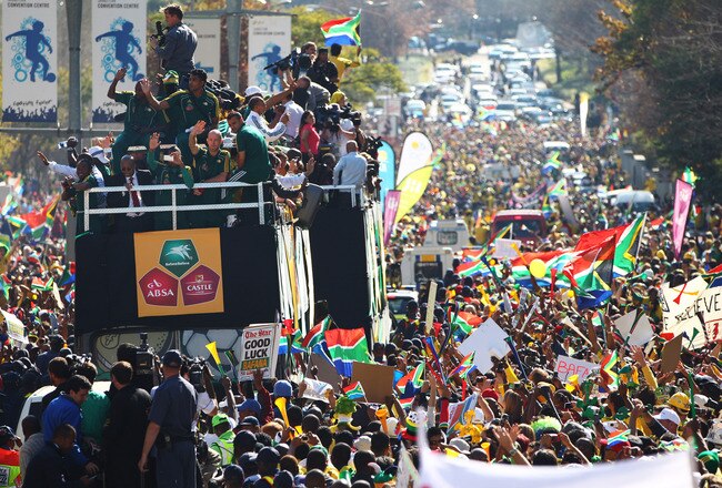 SANDTON, SOUTH AFRICA - JUNE 09:  The South Africa team parade through the district of Sandto nas thousands of local supporters cheer on June 9, 2010 in Sandton, South Africa.  (Photo by Michael Steele/Getty Images)