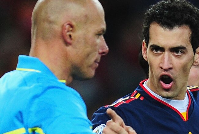 JOHANNESBURG, SOUTH AFRICA - JULY 11: Sergio Busquets, Andres Iniesta and Francesc Fabregas of Spain appeal to Referee Howard Webb during the 2010 FIFA World Cup South Africa Final match between Netherlands and Spain at Soccer City Stadium on July 11, 2010 in Johannesburg, South Africa.  (Photo by Clive Mason/Getty Images)