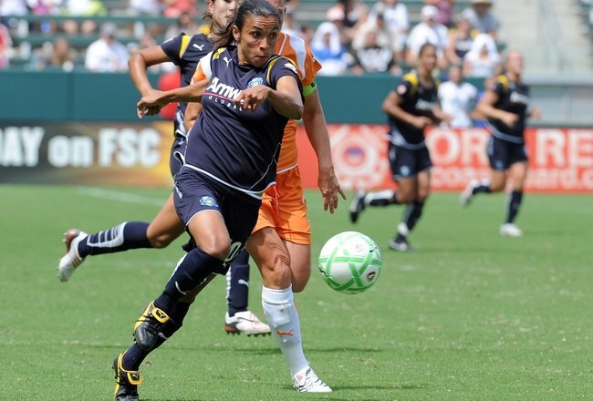 CARSON, CA - AUGUST 22:  Marta #10 of the Los Angeles Sol races for a ball in front of Christie Rampone #3 of the New Jersey Blue Sky at The Home Depot Center on August 22, 2009 in Carson, California.  (Photo by Harry How/Getty Images)